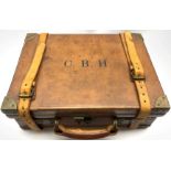 Early 20th Century brass bound leather cartridge case initialled 'C.B.H.' the oak lined base with fi