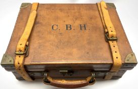 Early 20th Century brass bound leather cartridge case initialled 'C.B.H.' the oak lined base with fi