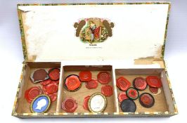 Box containing various wax seals etc