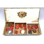 Box containing various wax seals etc