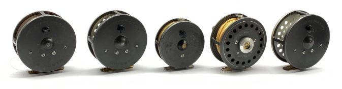 Five Hardy fly fishing reels comprising 'J.L.H. Salmon No669 Made by House of Hardy England', 'Marq