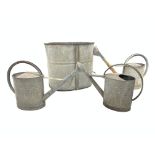 Three galvanised tin watering cans, galvanised water tank, H57cm