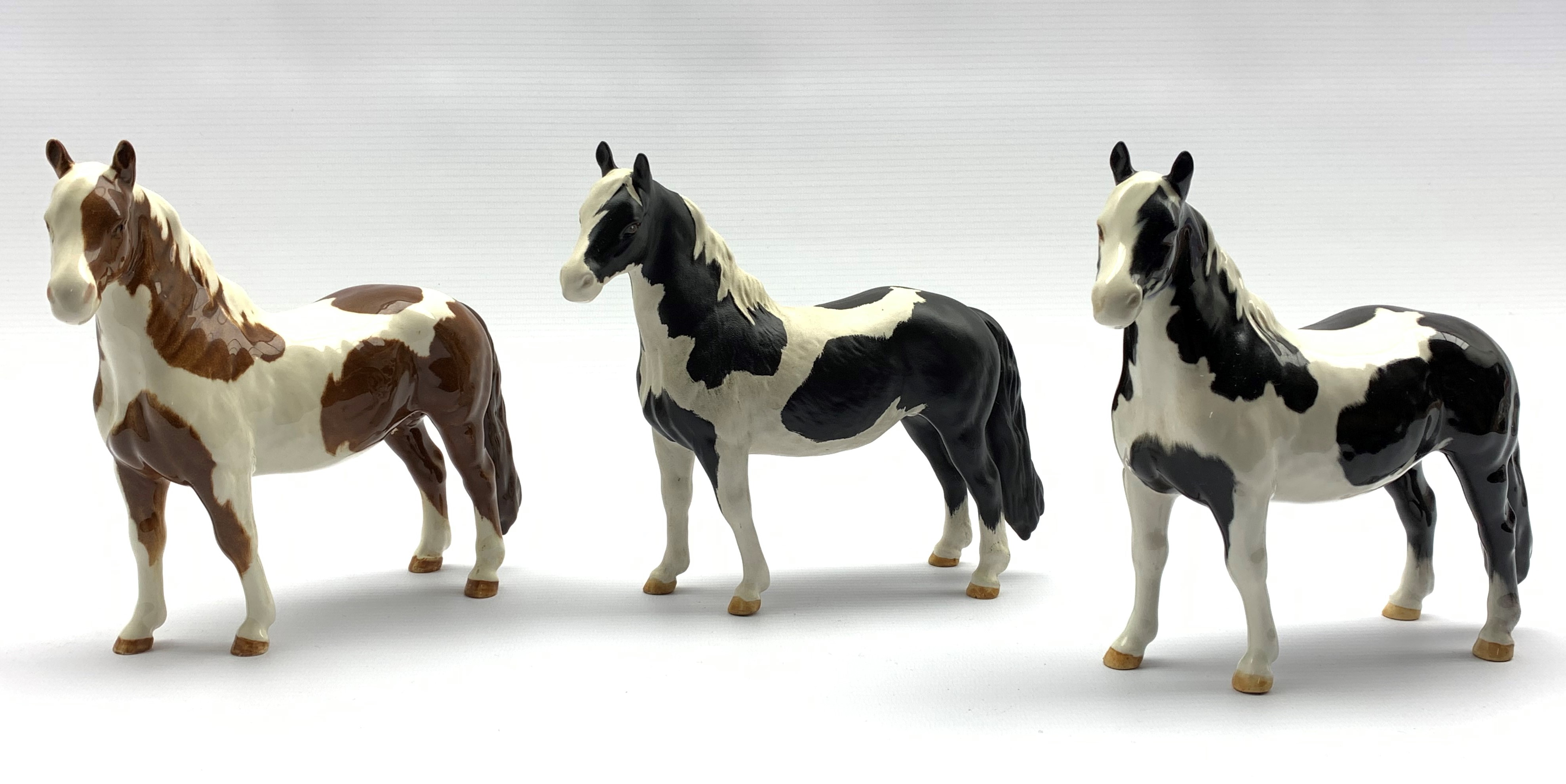Beswick Piebald Pinto pony in gloss, another matt and a Skewbald Pinto pony in gloss, Model No. 137