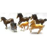 Six Beswick horses and foals including Two Cantering Shires in brown No. 975, Palomino foal No.947,