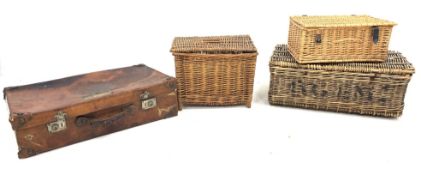 Early 20thCentury leather suitcase with shipping labels, L76cm, two wicker baskets and a wicker fish