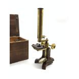 19th century brass microscope on cast iron base with four lenses in wooden case