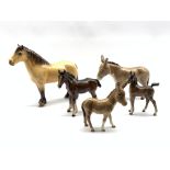 Beswick model of a Highland Pony No. 224, Beswick Donkey No. 2267A, Donkey Foal No. 2110 and two Bes