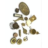 Small collectible items including brass note case, pocket watch stand, miniature bead work purse and