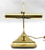Edwardian style brass desk lamp with adjustable cylindrical shade on pierced base with pen tray aper