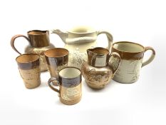 Collection of Doulton Lambeth relief moulded jugs, beakers and other stoneware together with a Victo