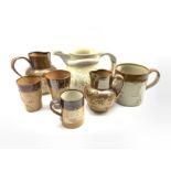 Collection of Doulton Lambeth relief moulded jugs, beakers and other stoneware together with a Victo