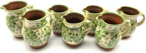 Peter Dick (1936-2012) Seven Coxwold studio pottery jugs (H19cm max)