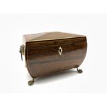 Regency rosewood two division tea caddy of sarcophagus form, brass lion mask handles above paw feet,