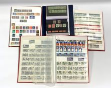 Four stockbooks and a small folder containing various mostly Great British and Commonwealth stamps i