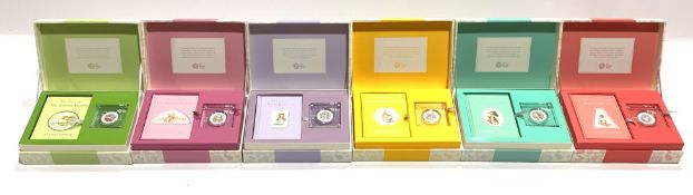 Six Beatrix Potter limited edition coin and book gift boxes, each containing a coloured silver proof