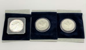 Two Queen Elizabeth II 1999 Canadian silver maple leaf five dollar one ounce coins and an Australian
