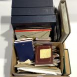 Mixed Great British and World stamps including Queen Elizabeth II mint stamps in albums, face value