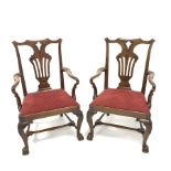 Pair of 19th century Chippendale style library elbow chairs, with ribbon carved cresting rail and p