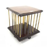 Edwardian walnut tabletop revolving bookcase, the serpentine top raised on brass struts creating fo