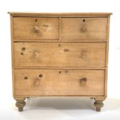 Victorian pine chest fitted with two short and two long drawers, with turned pull handles, raised o