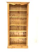 Solid pine open bookcase with fluted decoration enclosing five adjustable shelves, W89cm, H183cm, D