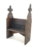 Victorian stained oak single seat pew, with profusely carved panel end supports, W88cm, H133cm, D41