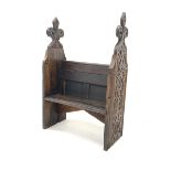 Victorian stained oak single seat pew, with profusely carved panel end supports, W88cm, H133cm, D41