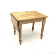 Early 20th century pine kitchen table with drop leaf, raised on turned supports, 63cm x 85cm, H73cm