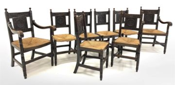 Set eight (6+2) early 20th century dark oak dining chairs, ball finials over floral carved back pan