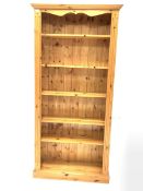 Solid pine open bookcase with fluted decoration enclosing five adjustable shelves, W89cm, H183cm, D