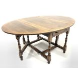 Very large oak Titchmarsh & Goodwin style drop leaf eight seater dining table with drawer to each e