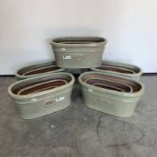 Five sets of three green glazed terracotta plant pots, W58cm