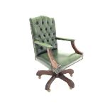 Modern mahogany open arm office chair, upholstered in deep buttoned green leather, moulded arm supp