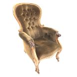 Victorian mahogany framed armchair, upholstered in deep buttoned brown velvet, with scrolled arm te