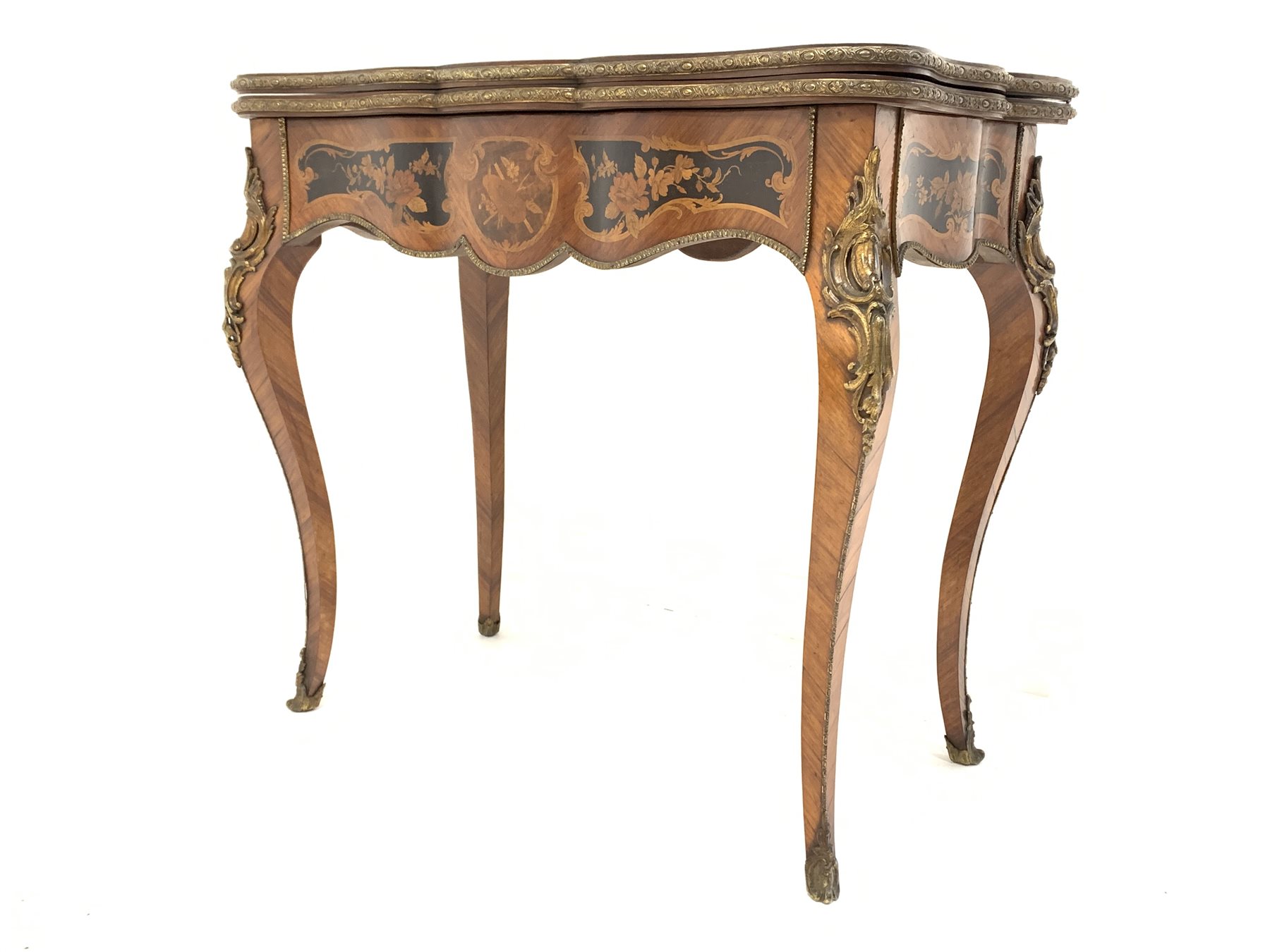 19th century French kingwood marquetry games table, the serpentine floral inlaid fold over revolvin