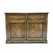 Solid oak 18th century style dresser base, the cross banded top over two drawer and two fielded pan