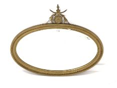 20th century gilt framed oval wall mirror, with acanthus leaf and sun flower pediment over egg and