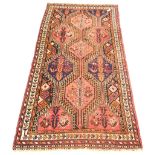 Oriental style red ground flat weave rug decorated with geometric designs and stylised chickens, 13