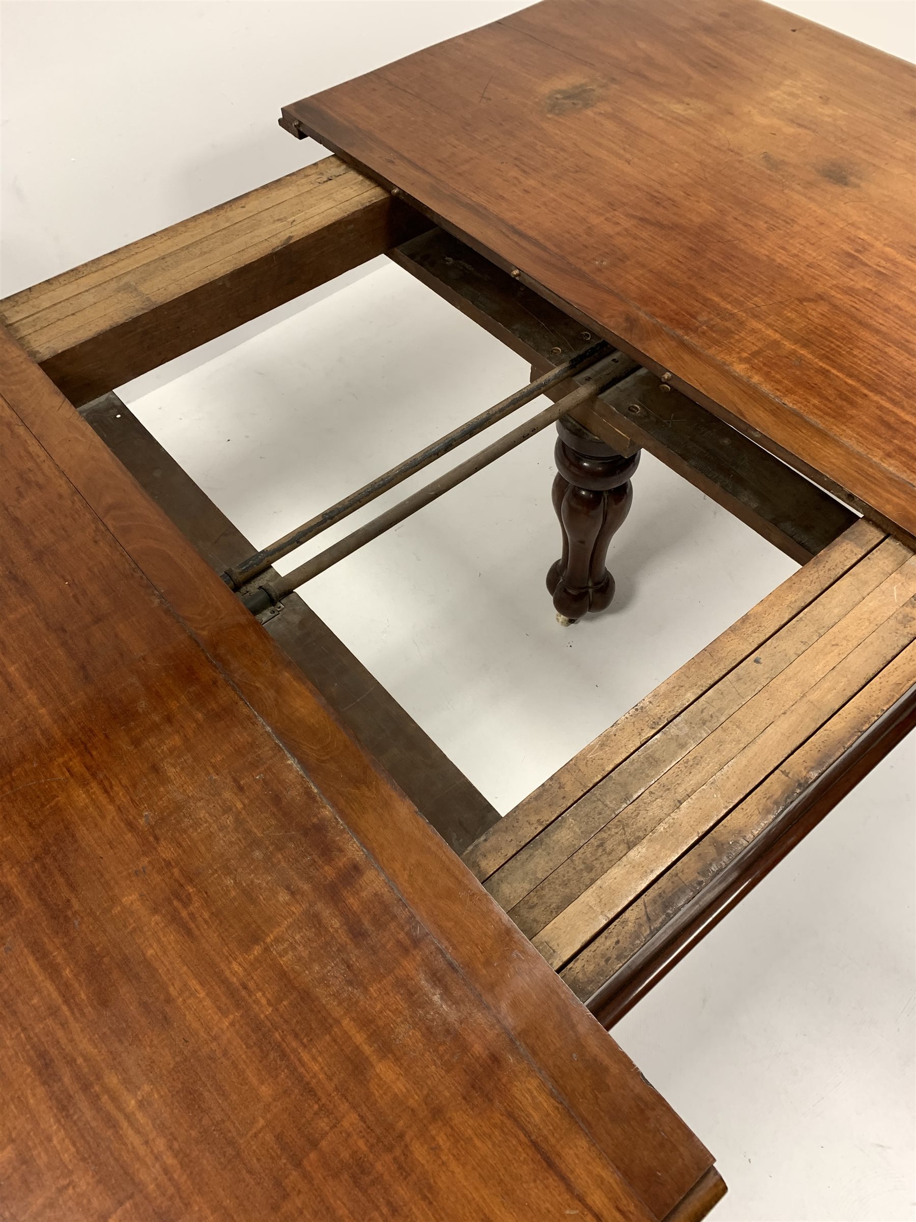 Large Victorian walnut extending dining table, the moulded top with 'D' shaped ends raised on leaf - Image 4 of 7