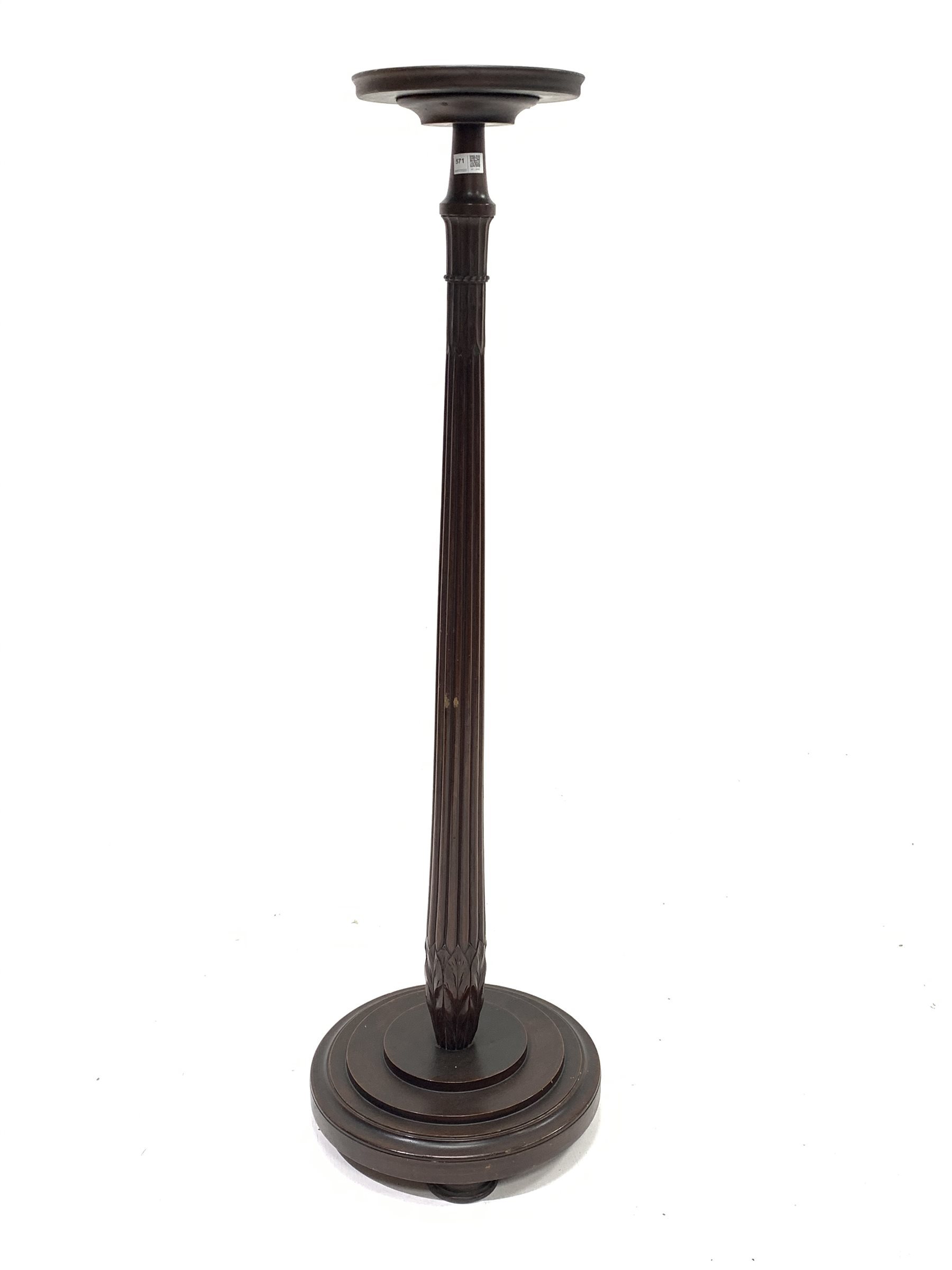 20th century mahogany jardiniere stand with circular top raised on turned reeded column and stepped