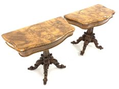 Pair Victorian well figured walnut serpentine card tables, the fold over revolving tops revealing b