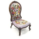 19th century walnut nursing chair with acanthus carved cresting rail over floral embroidered and be