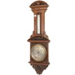 Victorian carved oak aneroid barometer and thermometer, with silvered registers, H101cm