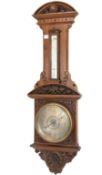 Victorian carved oak aneroid barometer and thermometer, with silvered registers, H101cm