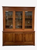 Large 20th century cherry French style library bookcase, three glazed doors with bevelled plates en