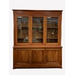 Large 20th century cherry French style library bookcase, three glazed doors with bevelled plates en