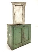 19th century green painted pine wall cupboard with two panelled doors enclosing two shelves, (W80cm