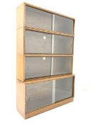 Early 20th century 'Simplex' oak stacking library bookcase with four shelves, each with sliding gla