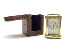 Early 20th century brass four glass carriage timepiece of serpentine form, white enamel dial and Ro