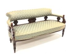 Late Victorian carved walnut framed three seat salon sofa, upholstered in patterned green fabric, r